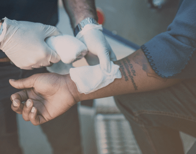 Man being treated by a nurse.