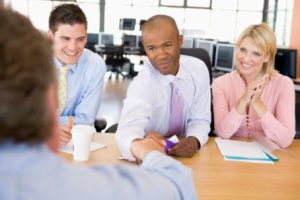 Shaking hands during a professional meeting.