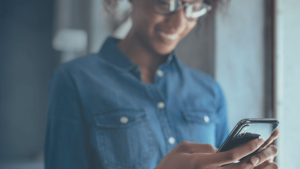 Woman looking at her cell phone.