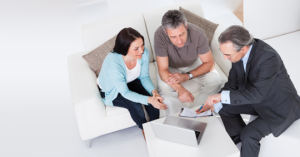 Three people in a meeting.