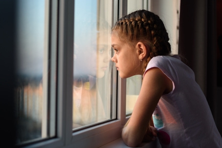 Girl looking out the window.