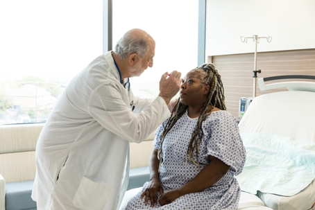 Doctor examining a patient's eyes.