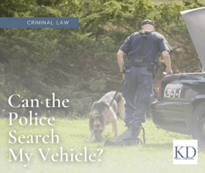 The image is an advertisement for a law firm specializing in criminal law. It poses a common legal question: "Can the police search my vehicle?". The ad includes the firm's logo, "KD", and a contact phone number. The design is clean and professional, with the legal question highlighted in a large, eye-catching font.